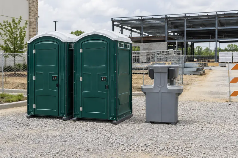 Portable facilities beside an active construction setting